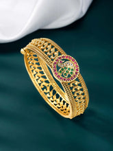 Traditional Kada with Intricate Design. Gold plated with green, white & purple stones. It has detailed design with screw opening. Best temple jewellery.