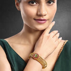 Traditional Kada with Intricate Design. Gold plated with green, white & purple stones. It has detailed design with screw opening. Best temple jewellery.