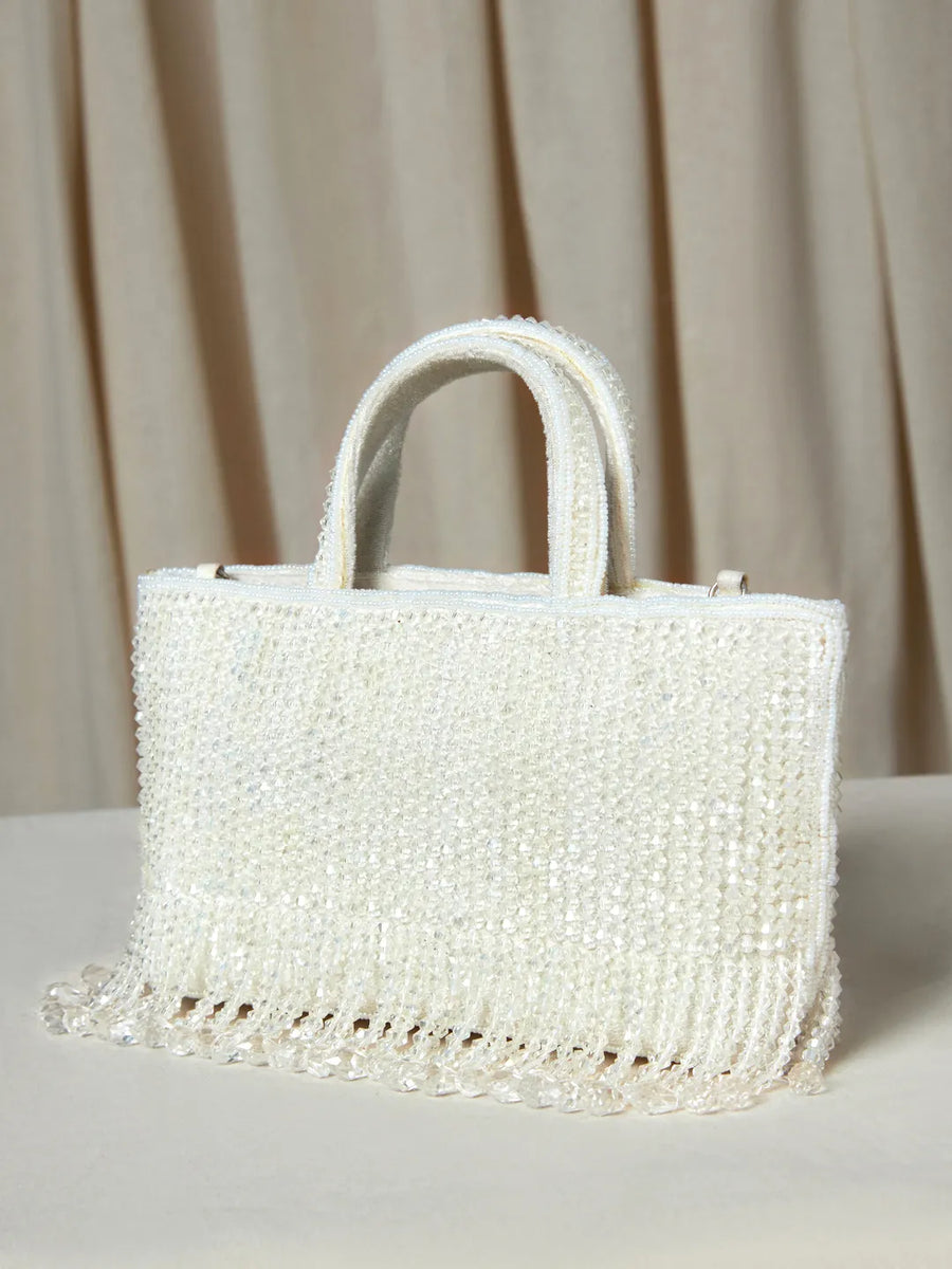 White clutch bag named Fringed Crystal Beaded Hand Purse, featuring artificial beads detailing and soft fabric texture | Peora
