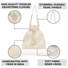 Cream potli bag named Heavy Zari Sequin Wedding Potli, featuring artificial beads detailing and soft fabric texture | Peora
