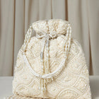 Cream potli bag named Heavy Zari Sequin Wedding Potli, featuring artificial beads detailing and soft fabric texture | Peora

