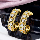 Sparkle & Shine CZ Hoop Earrings. Gold-plated hoop earrings with cubic zirconia stones from Peora.