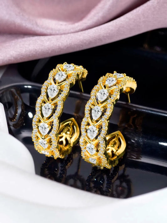Sparkle & Shine CZ Hoop Earrings. Gold-plated hoop earrings with cubic zirconia stones from Peora.