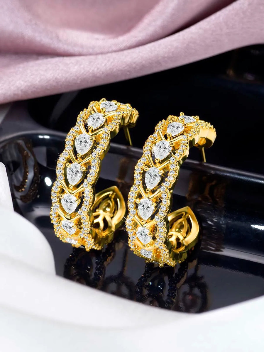 Sparkle & Shine CZ Hoop Earrings. Gold-plated hoop earrings with cubic zirconia stones from Peora.