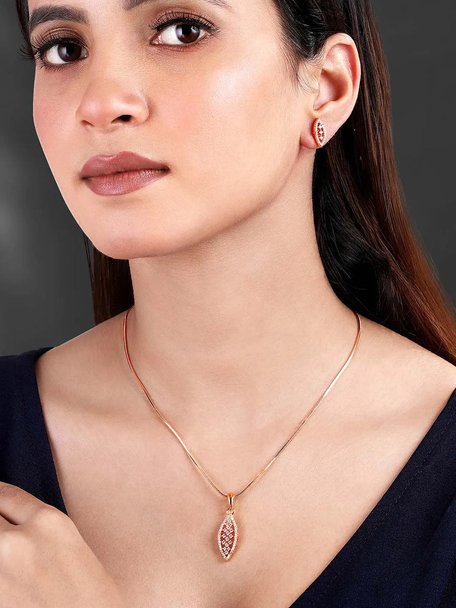 Leaf-Inspired Allure CZ Pendant Set by Peora. Rose gold-plated pendant set with leaf-inspired design & earrings.