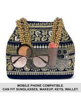 Blue potli bag named Chic & Glamorous Potli Collection, featuring artificial beads detailing and soft fabric texture | Peora
