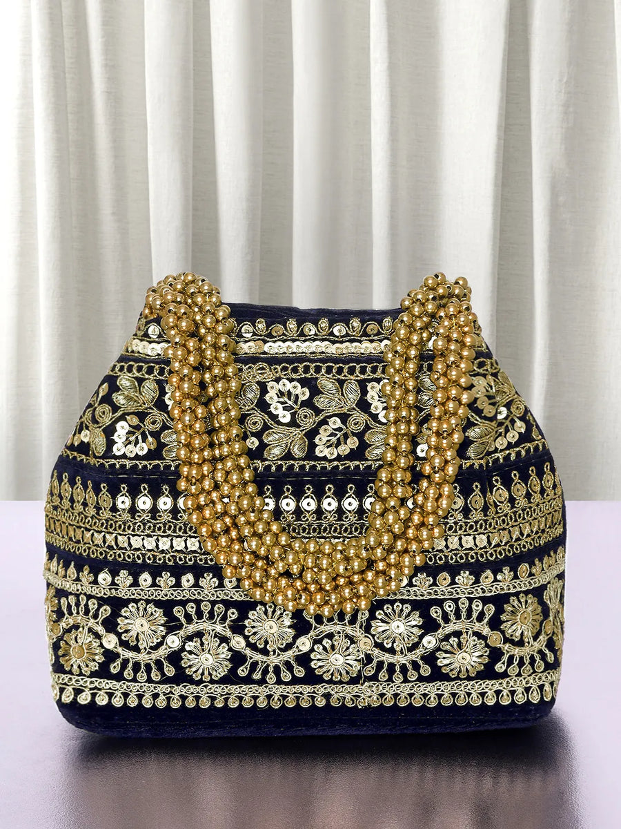 Blue potli bag named Chic & Glamorous Potli Collection, featuring artificial beads detailing and soft fabric texture | Peora
